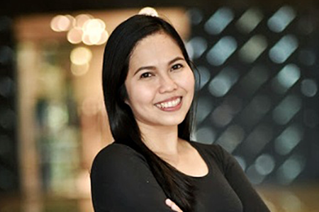 Maria Rowena Mariano smiling in corporate environnment
