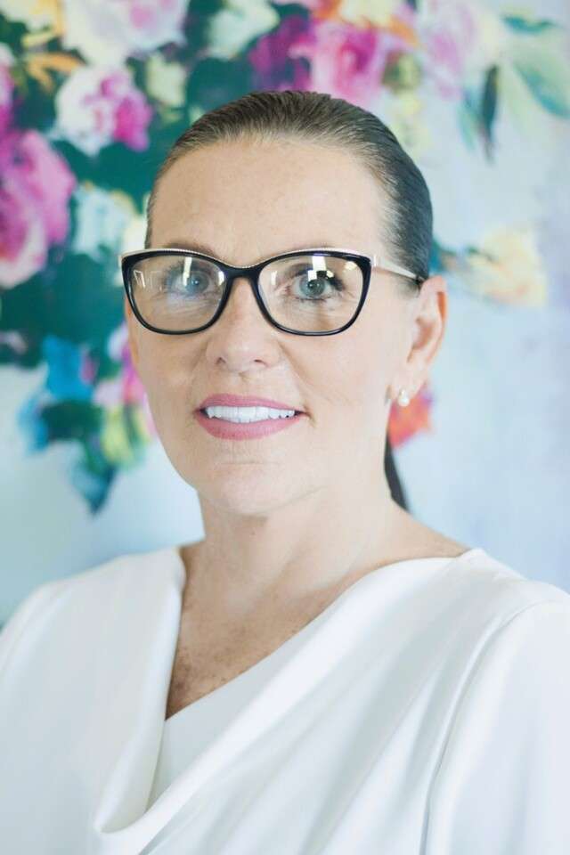 Alumna Dr Rebecca Wilcoxson wearing glasses