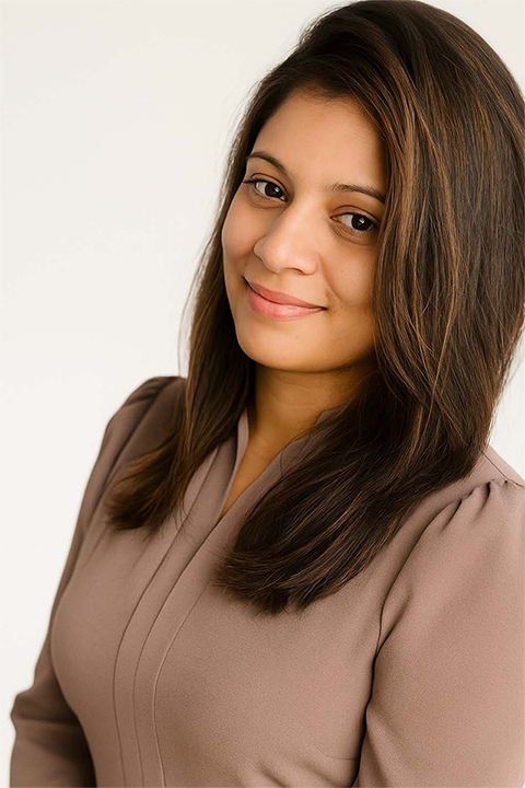 Nilusha Gayani Pathiraja smiling wearing brown top