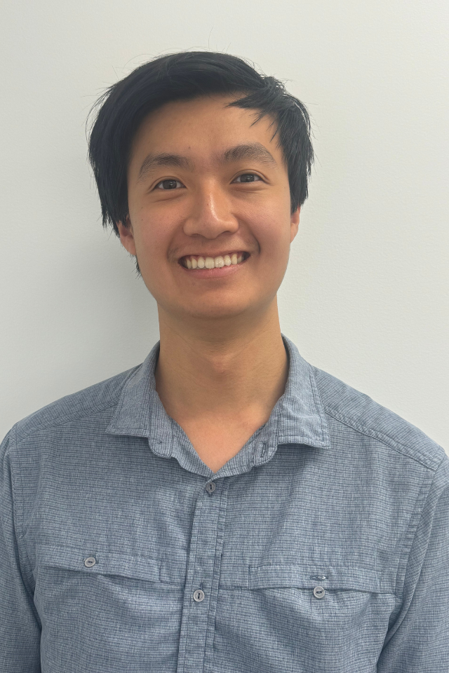 Alumnus Ethan Cao-Lee wearing a blue shirt