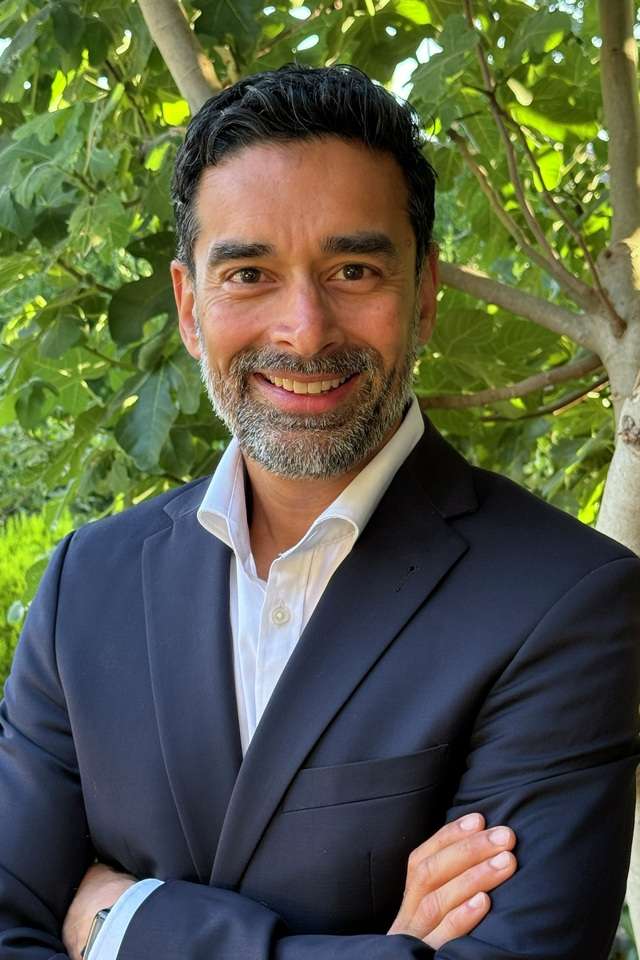 Alumnus Swapnil Gadgil wearing a suit