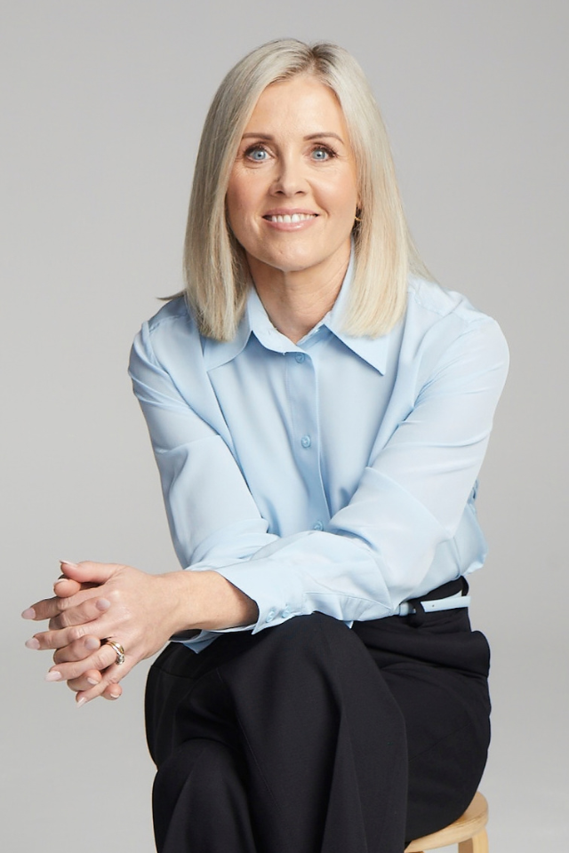 Alumnus Tanya O'Shea headshot wearing a blue shirt